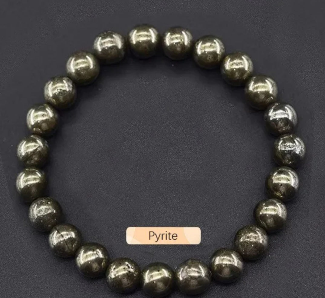 Pyrite beaded bracelet on a dark background with 'Pyrite' label