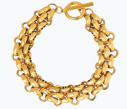 Gold chain bracelet on a white background