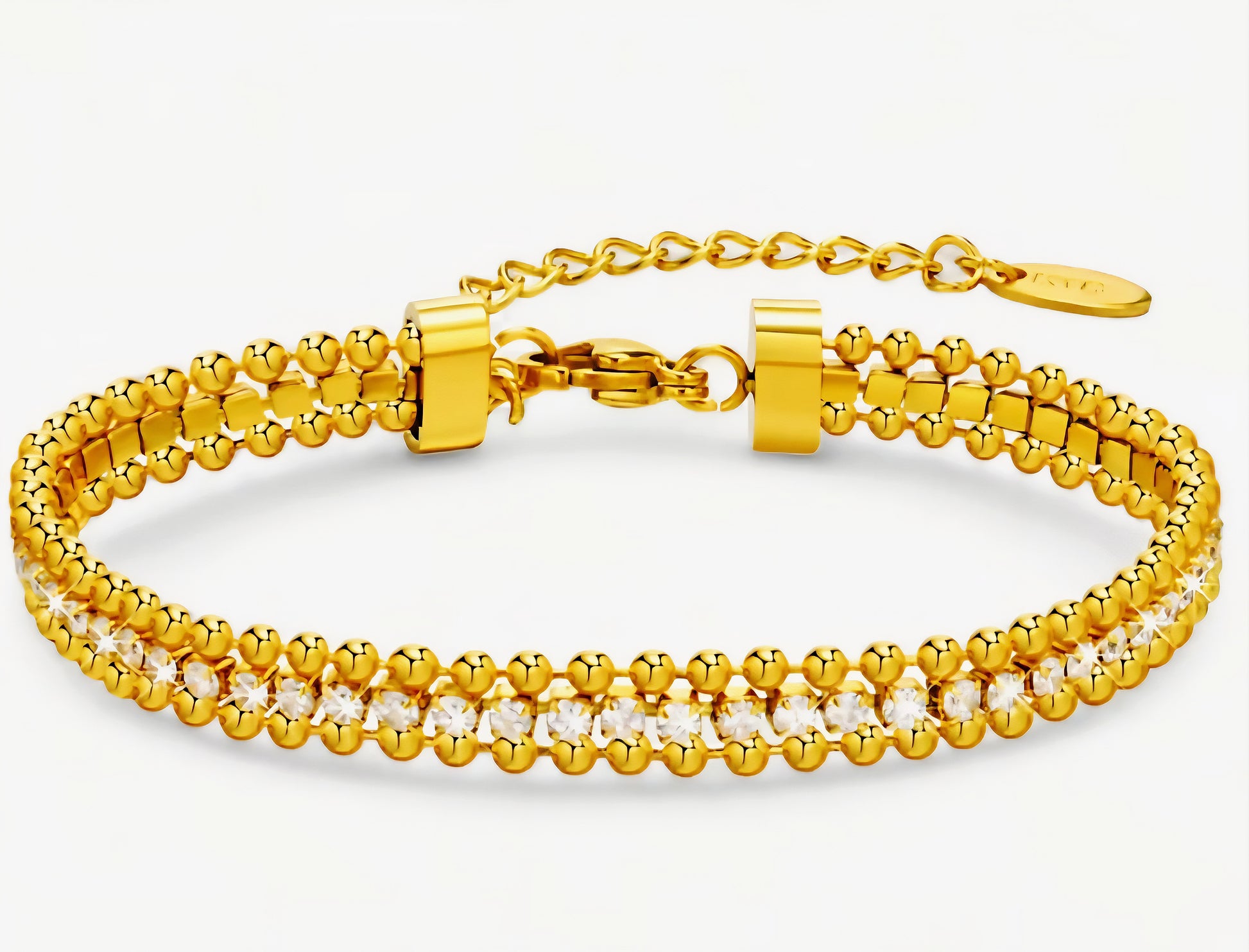 Gold tennis bracelet with beaded  pattern on a light gray background

