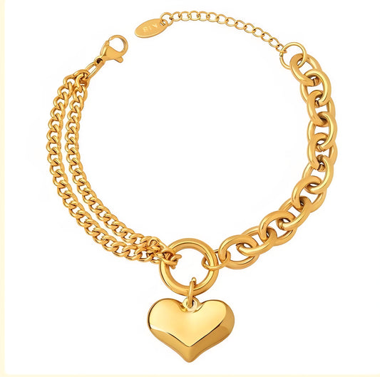 Gold chain bracelet with a heart-shaped charm on a white background