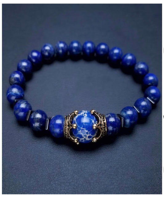 Blue Lapis Lazuli crystal bracelet on a blue background.