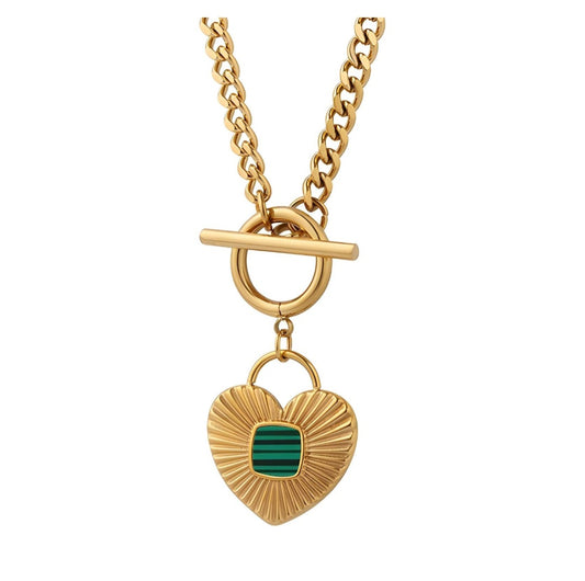 Gold necklace with a heart-shaped pendant featuring a green stone on a white background