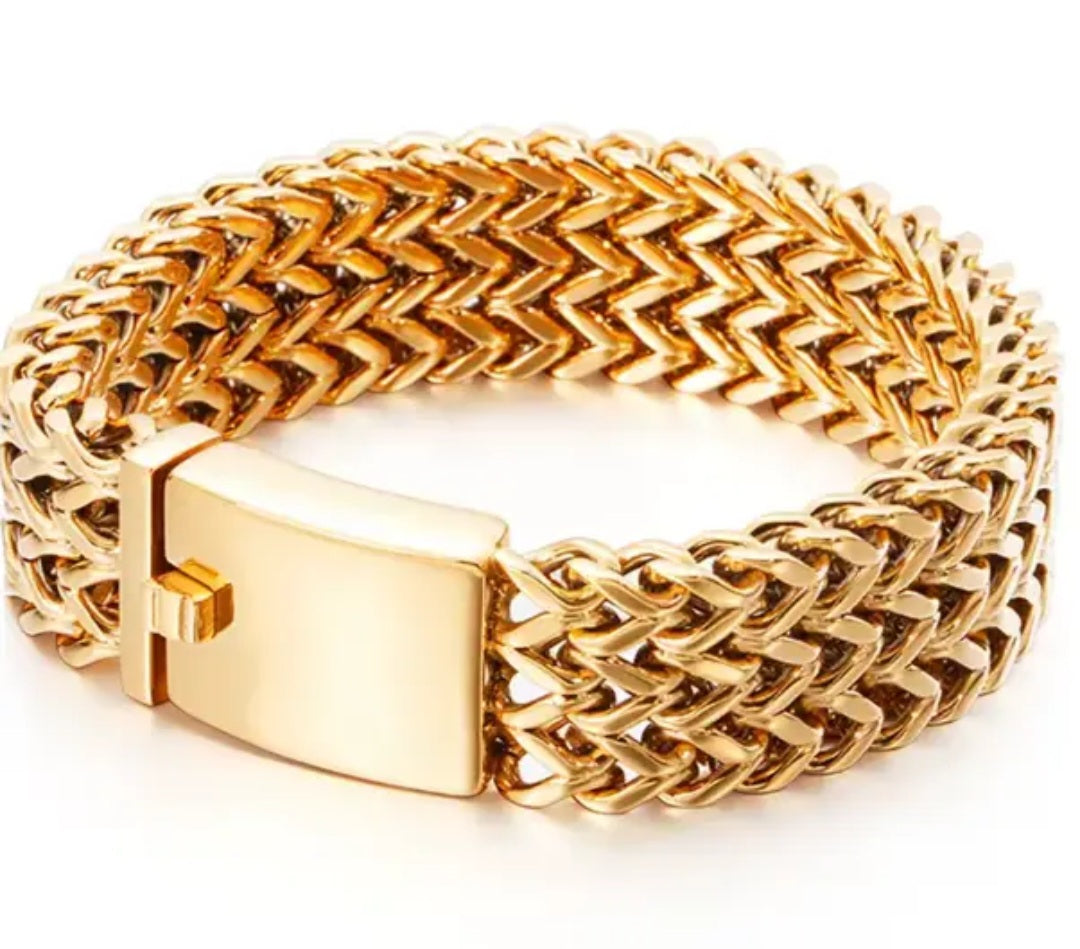 Gold chain bracelet on a white background