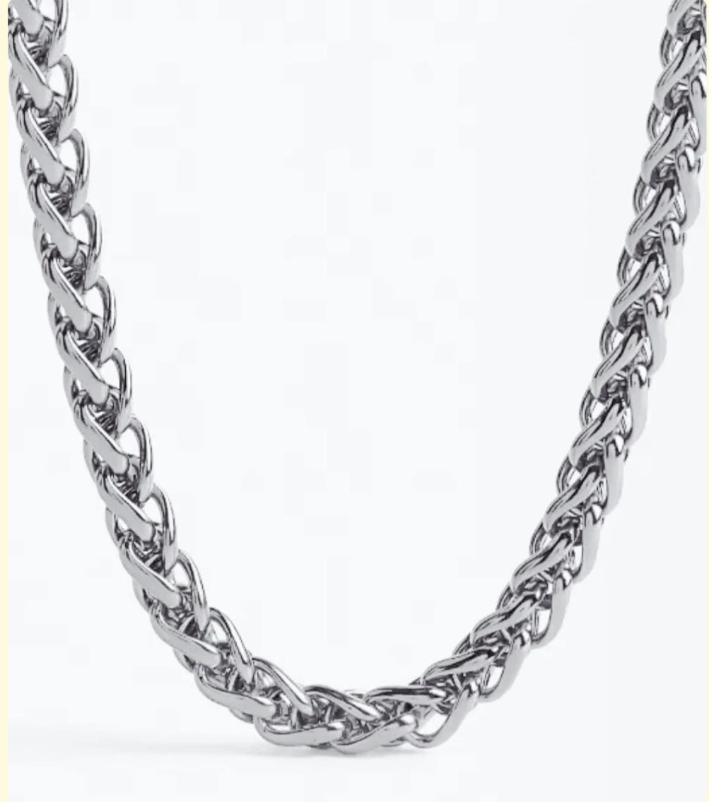 Silver chain necklace on a white background