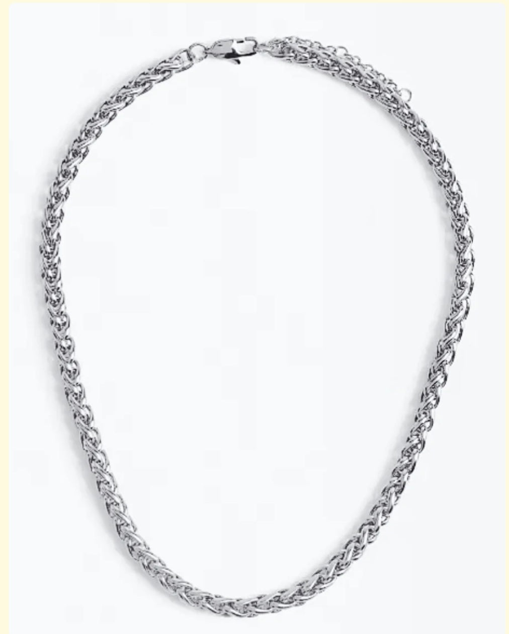 Silver chain necklace on a white background